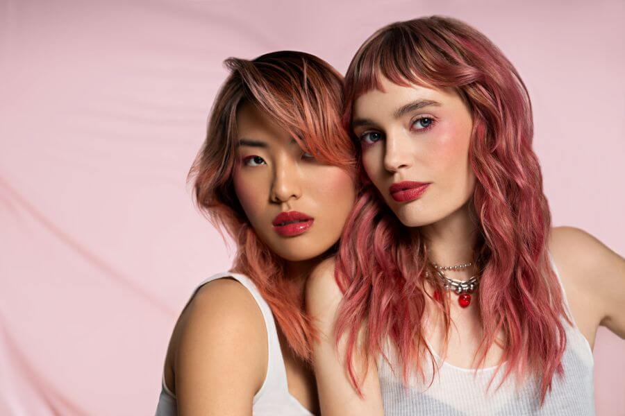 Vibrant coral hair and dark pink hair created with ChromaSilk VIVIDS Juicy and Crush for bold, fantasy hair and creative color inspiration.