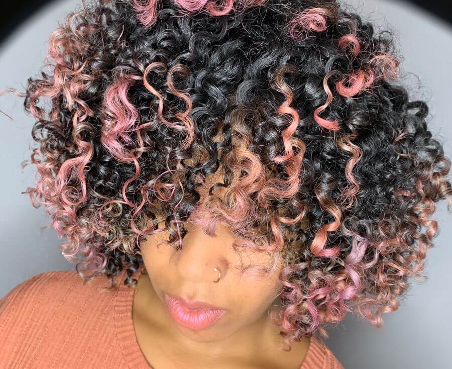 PRAVANA VIVIDS custom pink lends pops of color to rich, brunette curls.