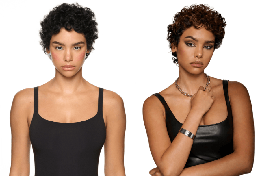 Cropped curly hair with caramel highlights creating warm accents and glossy definition.